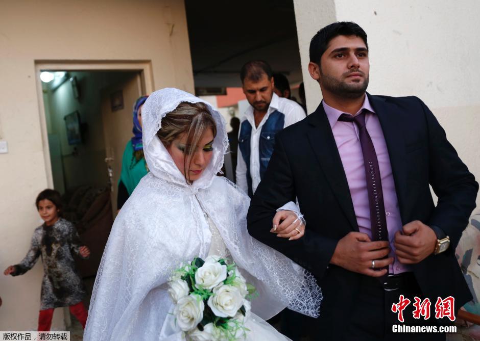 伊拉克什叶派小伙迎娶逊尼派美娇娘(高清组图