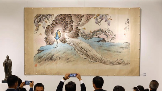 ��������Ȼ������ͬ�塱������Ʒչ��������Ļ