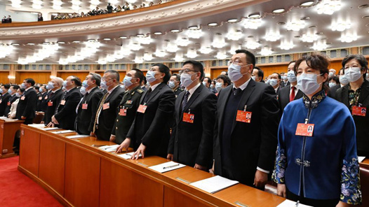 王晨作十四届全国人大代表名额和选举问题的决定草案的说明